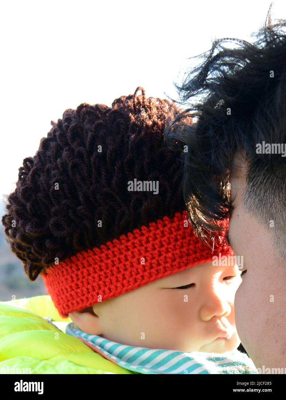 A proud Chinese dad with his cute baby. Beijing, China. Stock Photo
