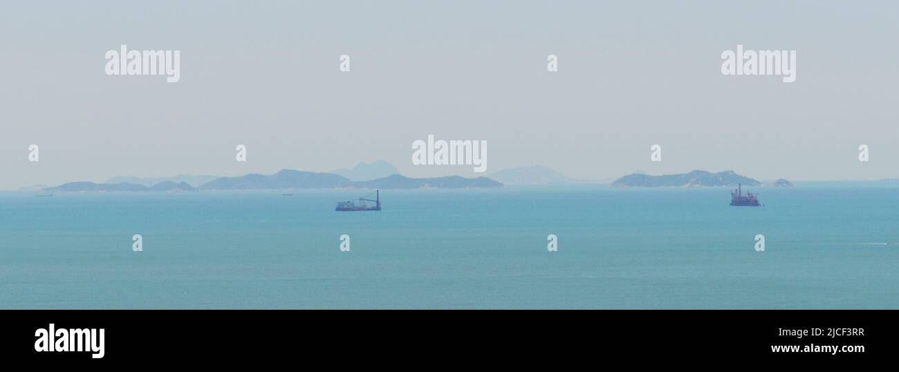 A faraway view of the remote outlaying islands to the south of Lantau Island in Hong Kong. Stock Photo