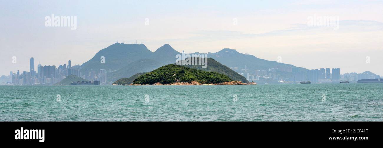 A Faraway view of Hong Kong island seen from Peng Chau island in Hong Kong. Stock Photo