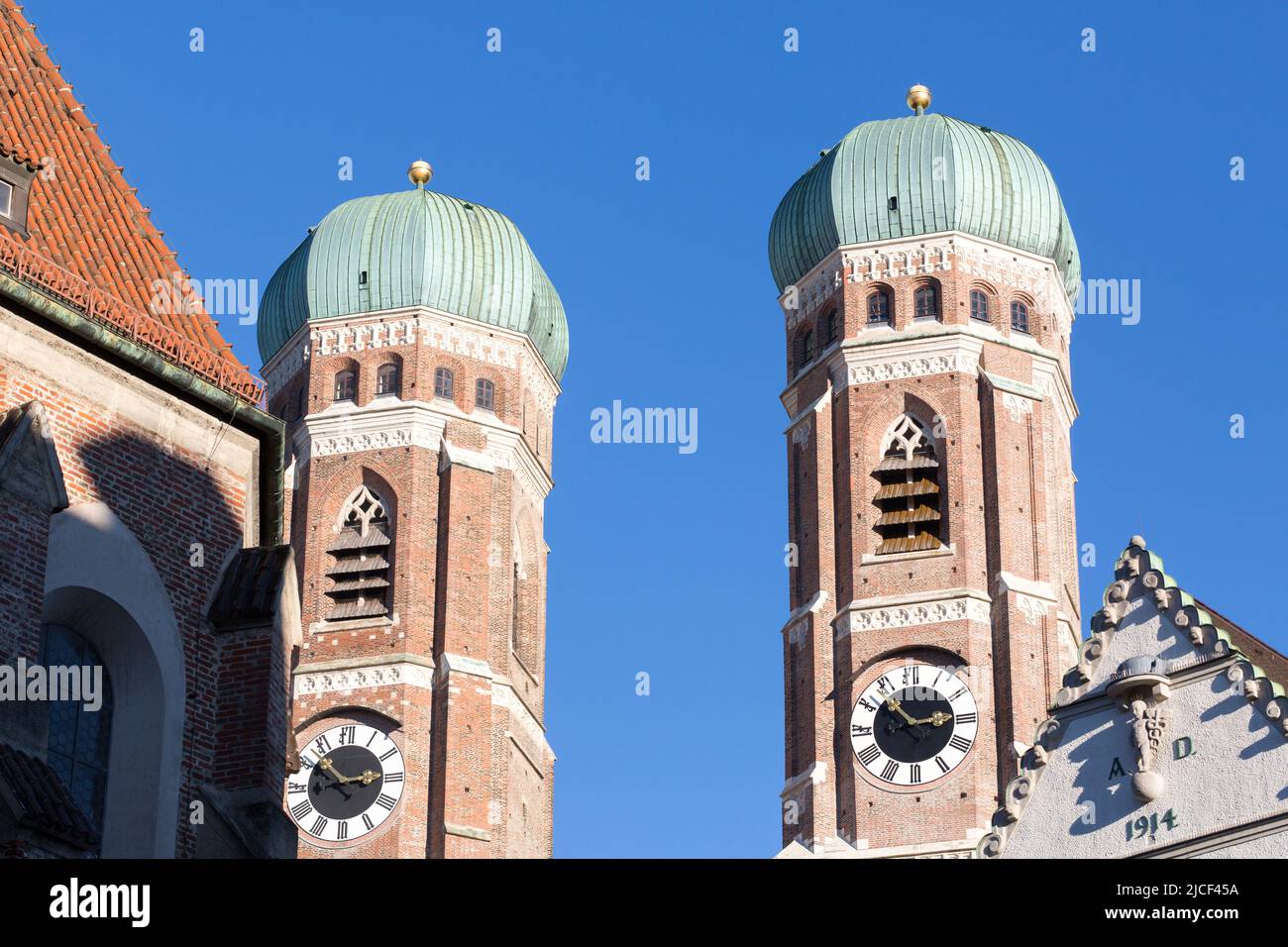 Munich, Germany - Jan 14, 2022: View on the two steeples of the Frauenkirche (Cathedral of our dear lady). Landmark of Munich. Stock Photo
