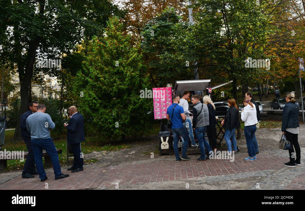 Ukrainians buying coffee at a mobile coffee shop in central Kyiv, Ukraine. Stock Photo
