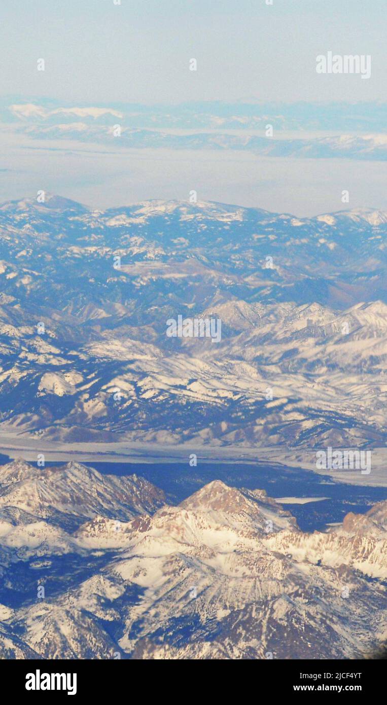 Flying over snow covered mountains in the North western part of the USA. Stock Photo