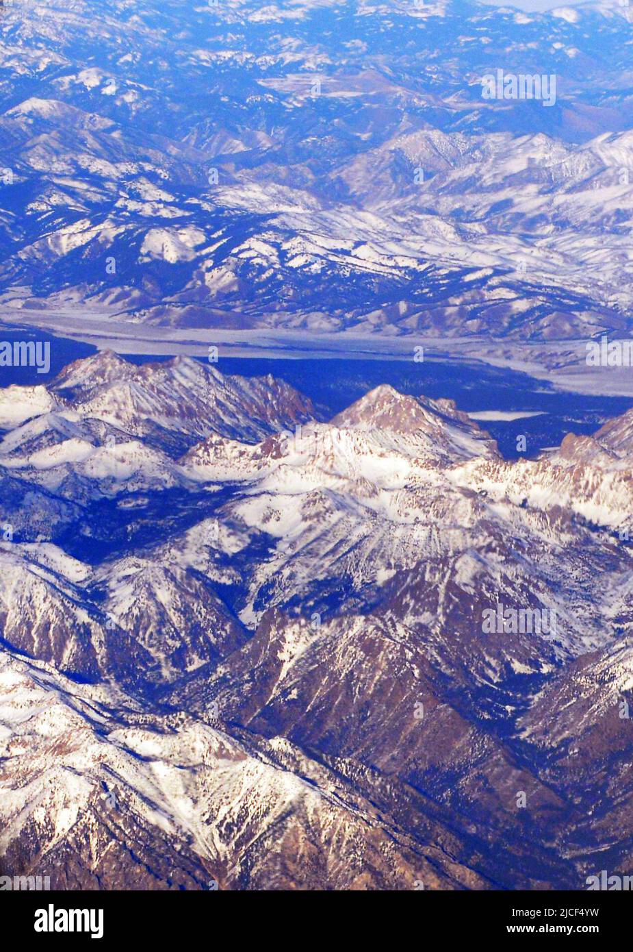 Flying over snow covered mountains in the North western part of the USA. Stock Photo