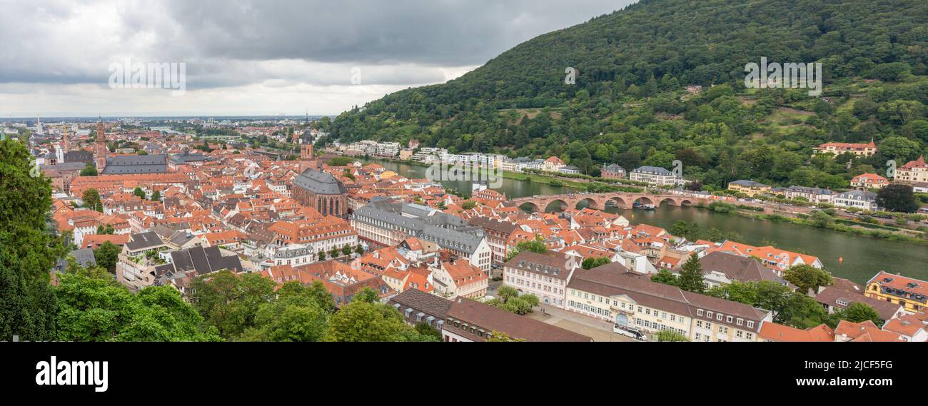 Heidelberg, Germany - Aug 27, 2021: Cityscape of Heidelberg. With view on the old bridge (Alte Brücke) and the church of the holy spirit. Stock Photo