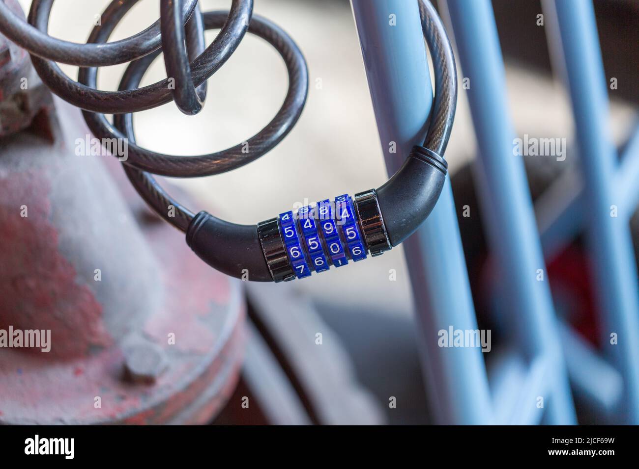 Essen, Germany - Mar 26, 2022: Close up of a locked four-digit combination lock for bicycles. Stock Photo