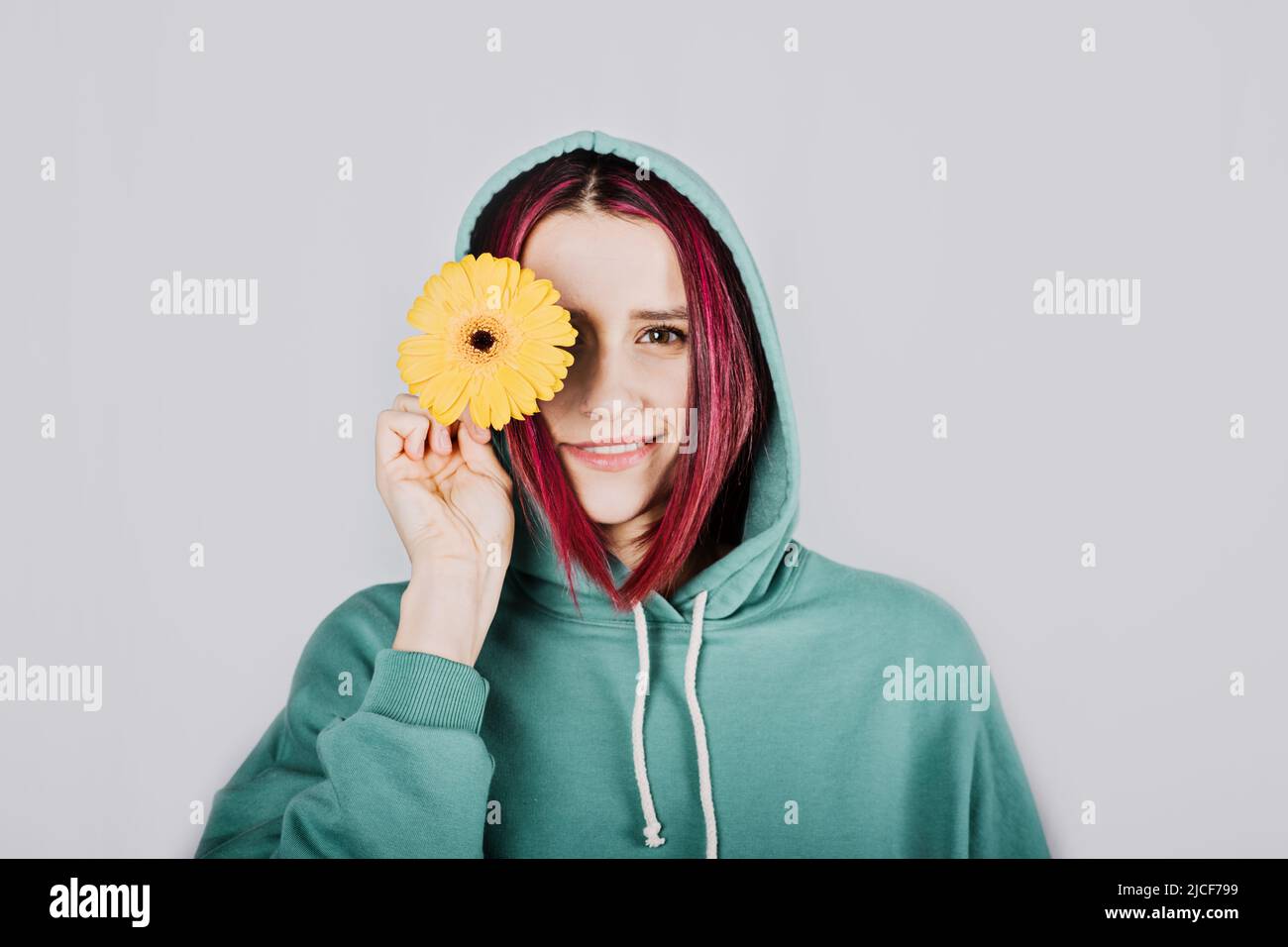 Studio shot of purple hair Hoody woman in long sleeve tracksuits hoodie activewear set Stock Photo