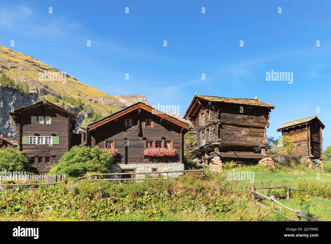 Traditional wooden houses in Furi, Zermatt, Swiss Alps, Valais, Switzerland Stock Photo