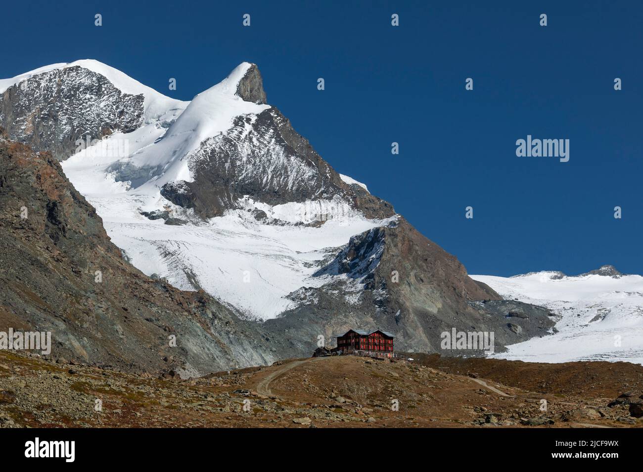 Berghaus Fluhalp (2606m), Findel glacier behind, Zermatt, Alps, Valais, Switzerland Stock Photo