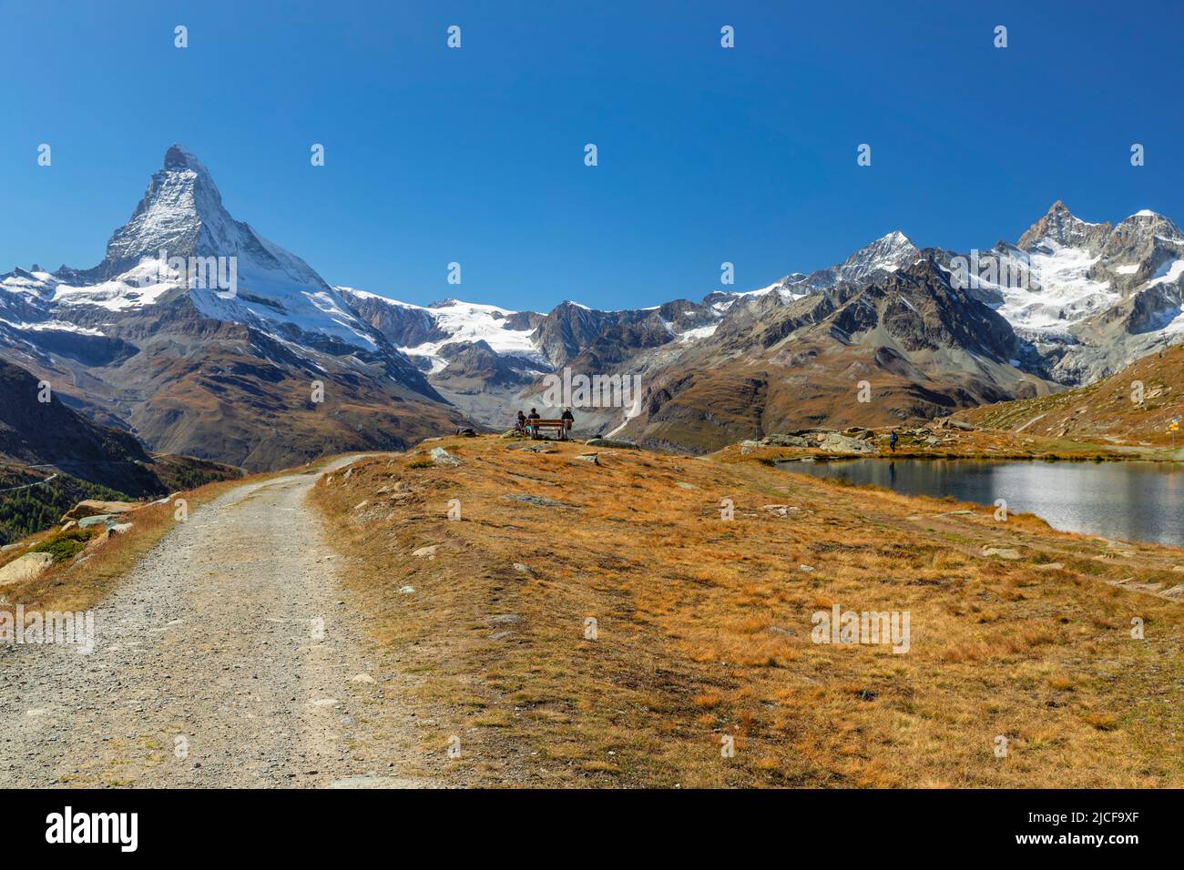 Hiking trail at Stellisee with view to Matterhorn (4478m), Alps, Valais, Switzerland Stock Photo