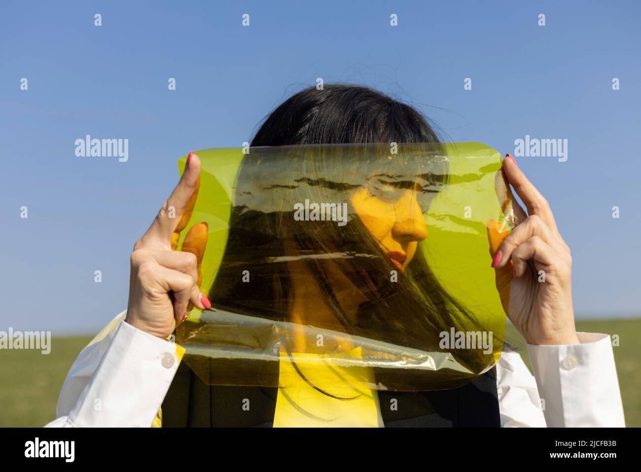 View to the side behind yellow color foil Stock Photo