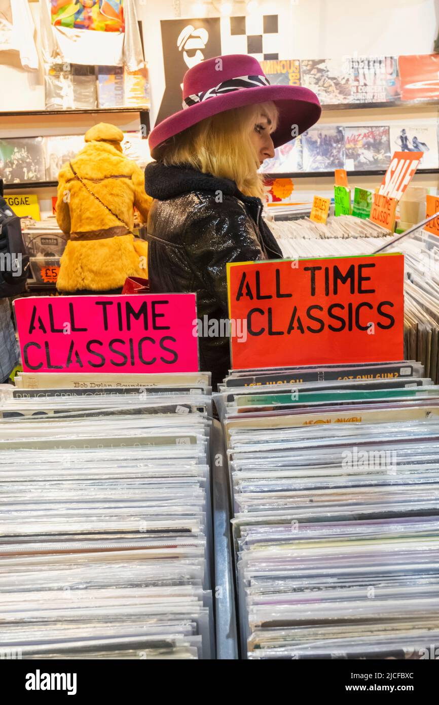 England, London, Shoreditch, Brick Lane, Vintage Record Shop, Woman Buying Vinyl LP Records Stock Photo