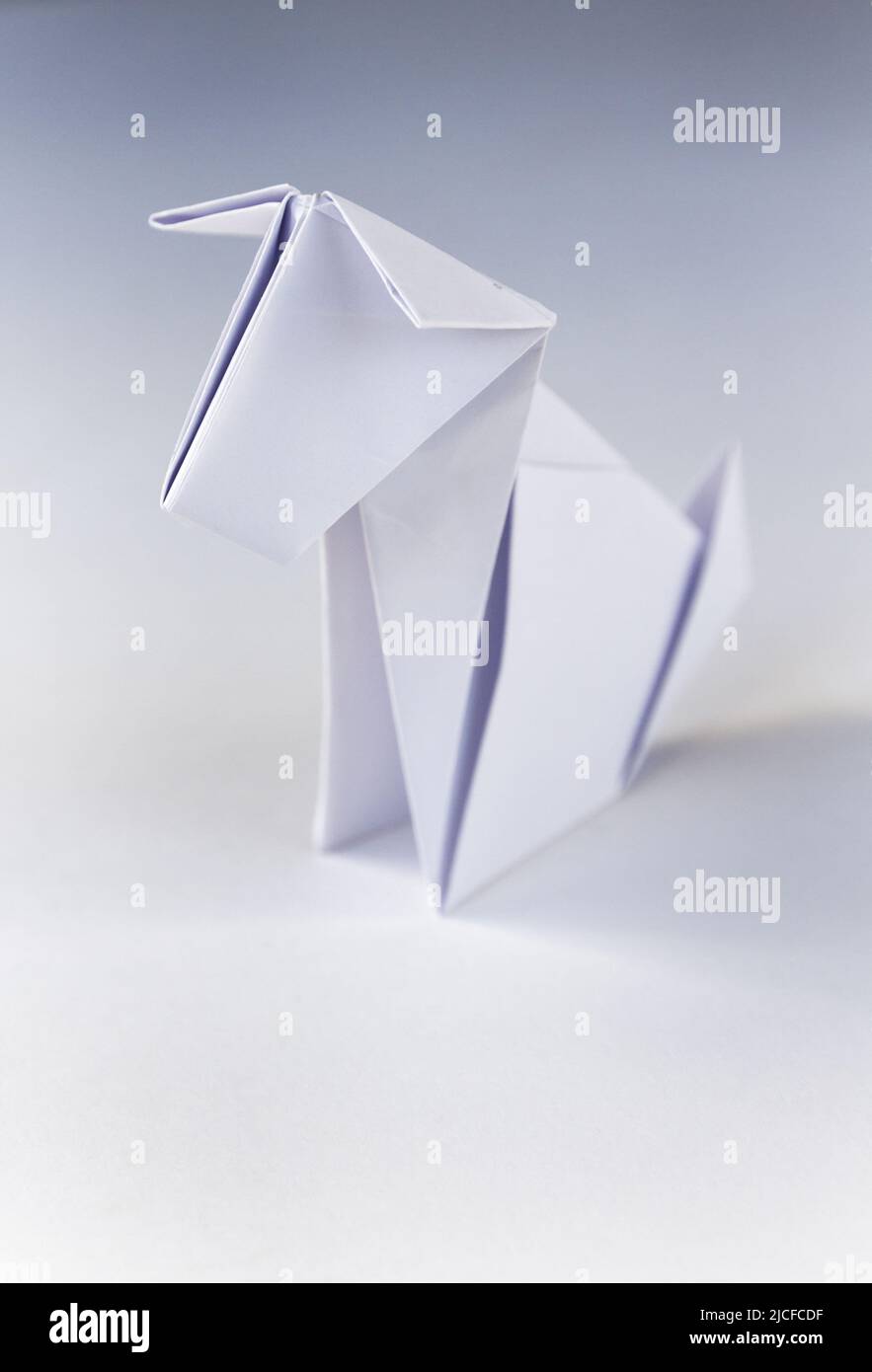 Paper dog origami isolated on a blank white background. Stock Photo