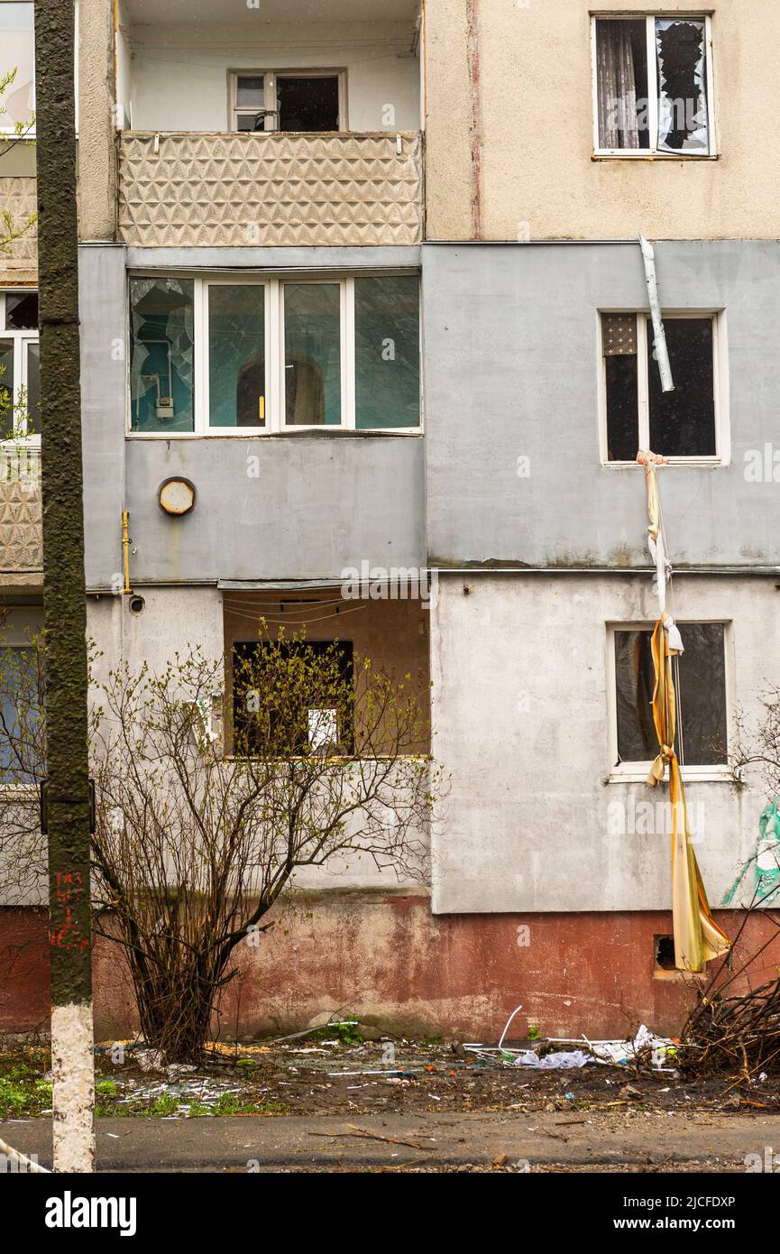destroyed houses in Borodianka, tied together sheets to escape from the apartment Stock Photo