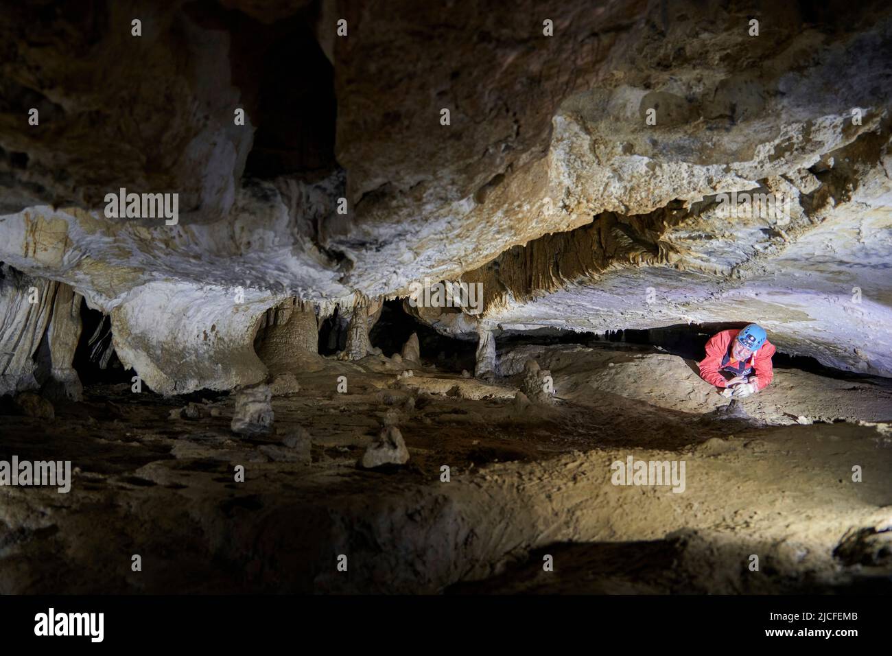 Cave explorer in the Grotto de la Tuilerie in France Stock Photo