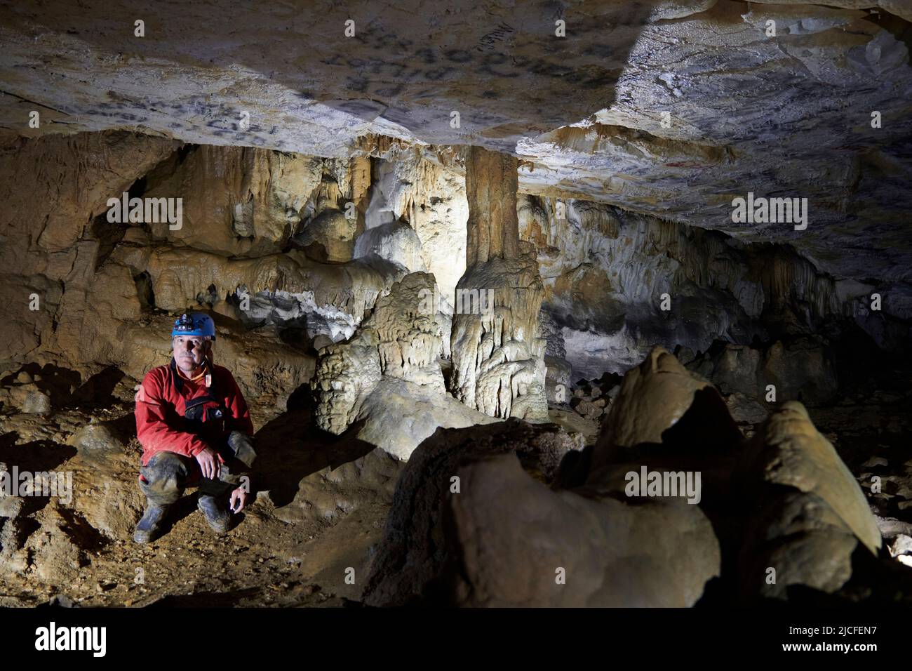 Cave explorer in the Grotto de la Tuilerie in France Stock Photo