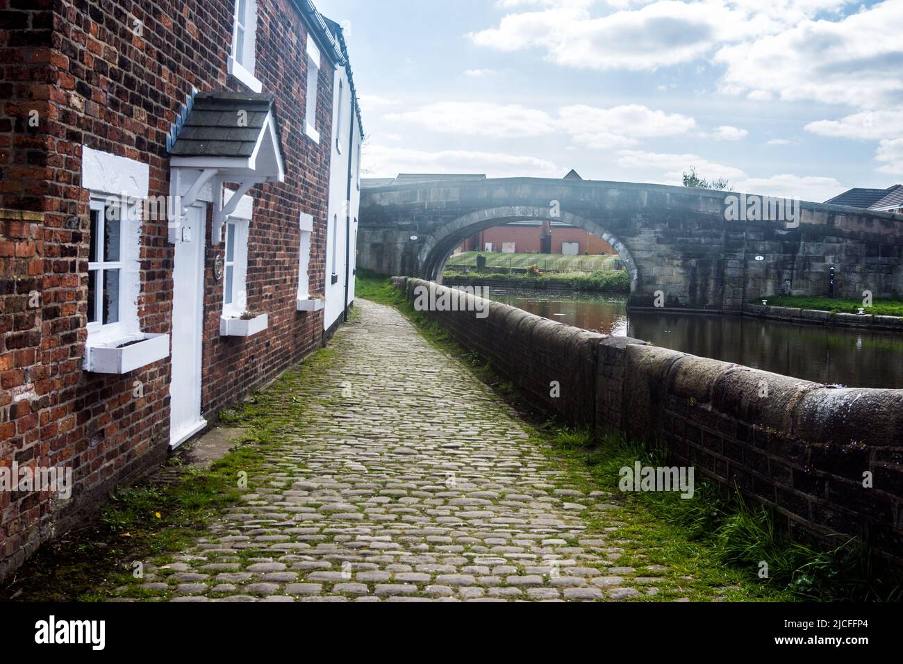 Terraced houses at the start of the Rufford branch of the Leeds - Liverpool canal. Stock Photo