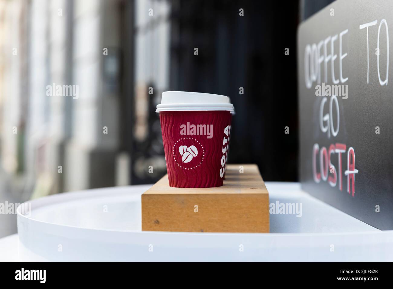 Belgrade, Serbia - November 15, 2021: Costa Coffee cups on the table. Takeaway, coffee to go. Costa Coffee is large British multinational coffeehouse Stock Photo