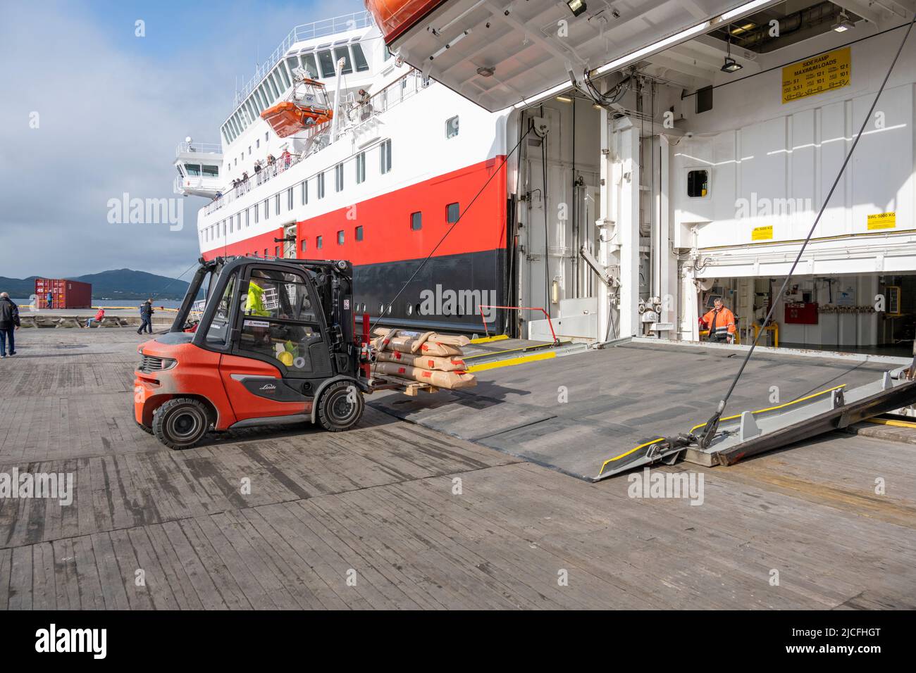 Norway, Troms og Finnmark, Hurtigruten ship 'Nordlys' in Finnsnes harbor. Stock Photo