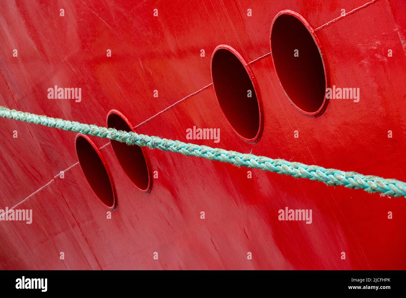 Ship, portholes on red ship wall Stock Photo Alamy