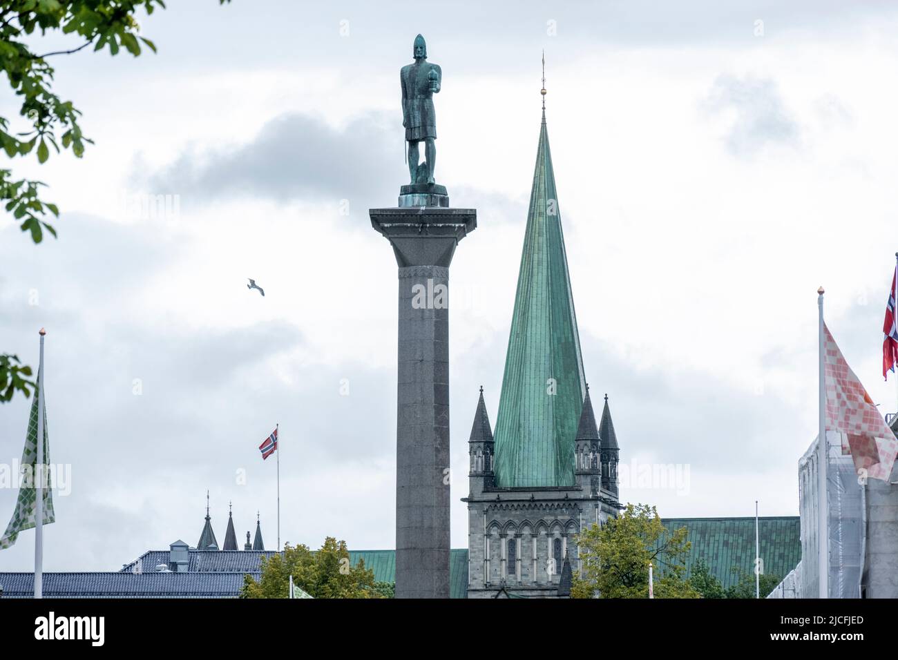 Norway, Trøndelag, Trondheim, Olav Tryggvason statue with Nidaros Cathedral. Stock Photo