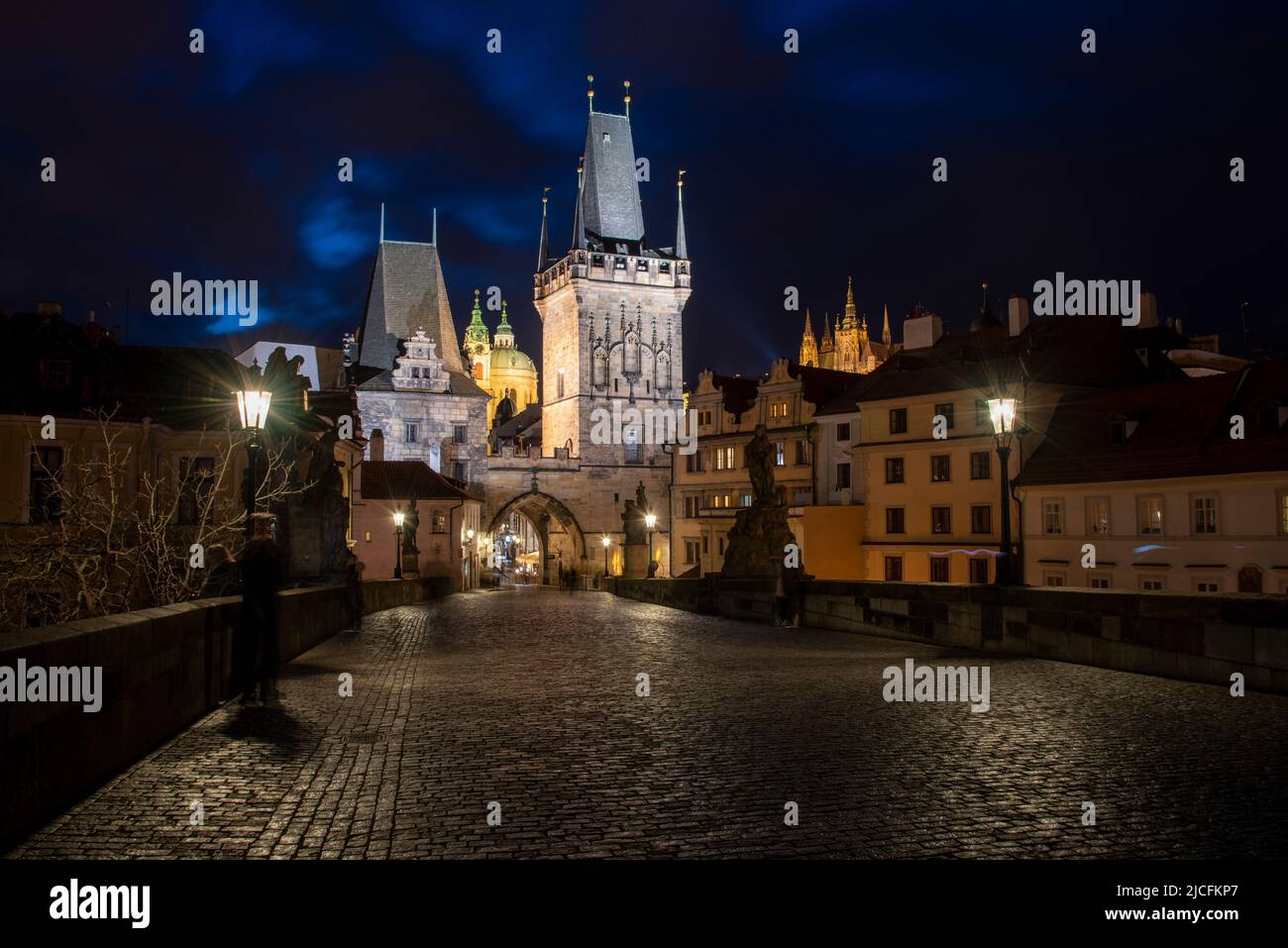 Charles Bridge with Bridge Tower on the Lesser Town, behind it Saint Nicholas Church, on the right Prague Burger with St. Vitus Cathedral, Prague, Czech Republic Stock Photo