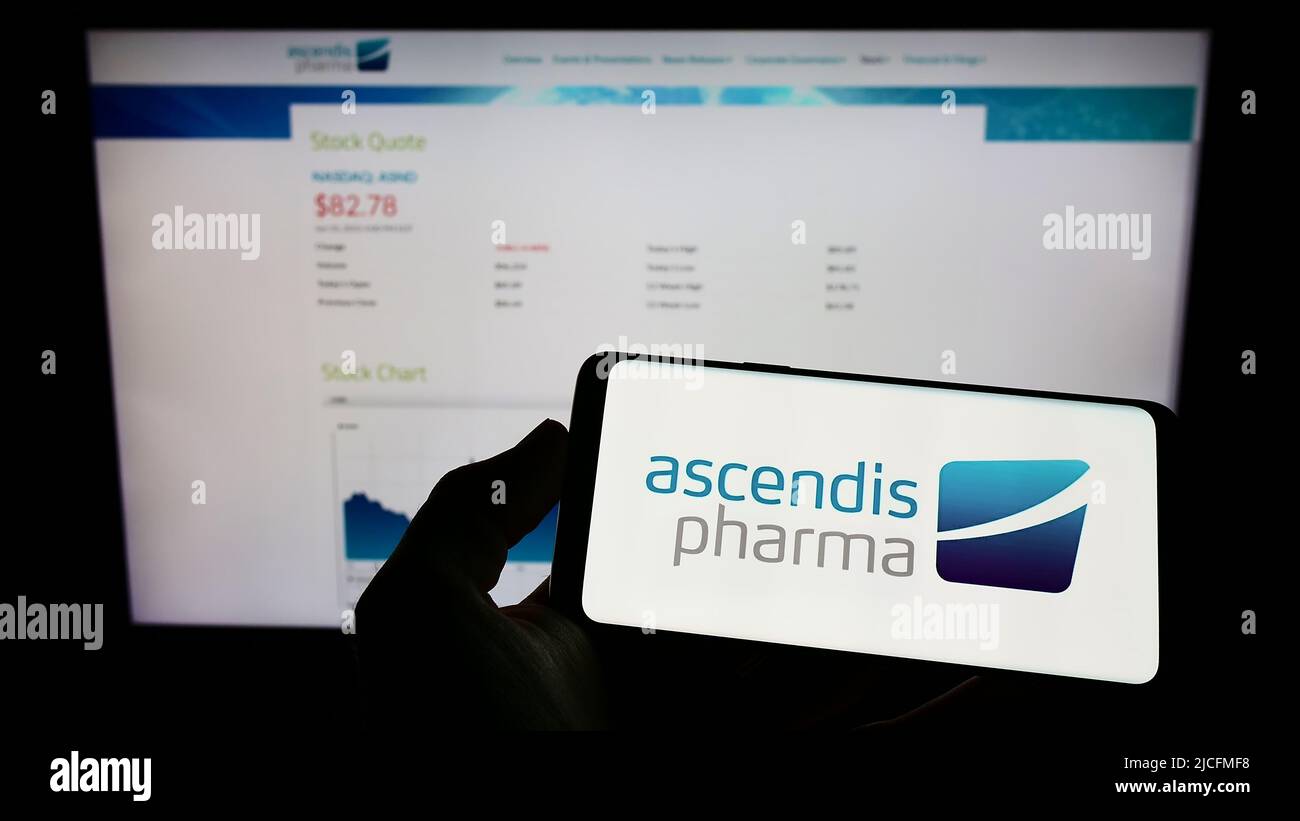 Person Holding Mobile Phone With Logo Of Biotechnology Company Ascendis ...