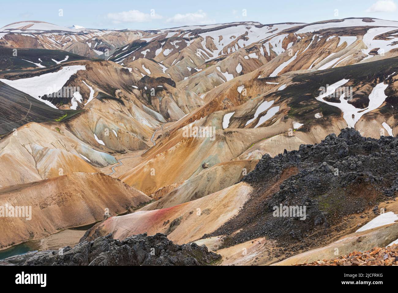 Laugavegur hiking trail is the most famous multi-day trekking tour in Iceland. Landscape photo from the area around Landmannalaugar, starting point of the long-distance hiking trail in the highlands of Iceland. Stock Photo