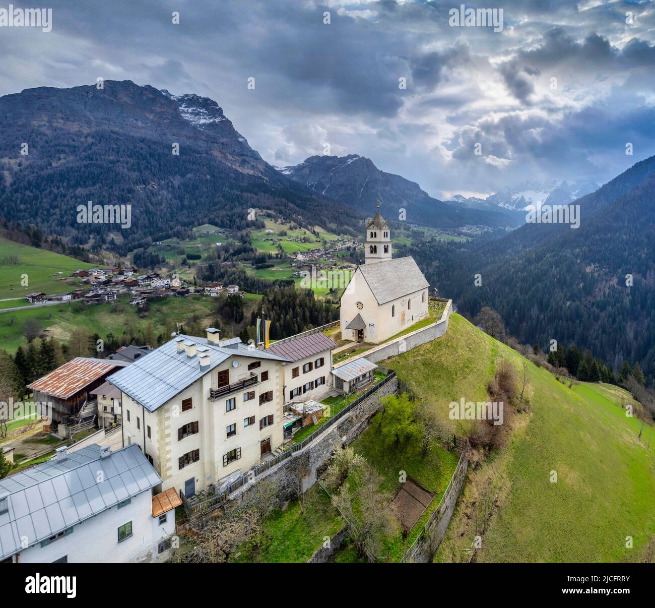 Italy, Veneto, Belluno provice, the alpine village of Colle Santa Lucia with the ancient church on the hill Stock Photo