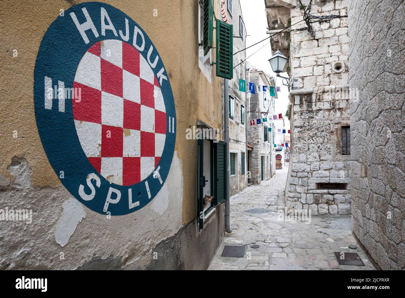Mural 'Hajduk Split' and narrow alley in small town Vodice, Sibenik-Knin County, Central Dalmatia, Croatia, Europe Stock Photo