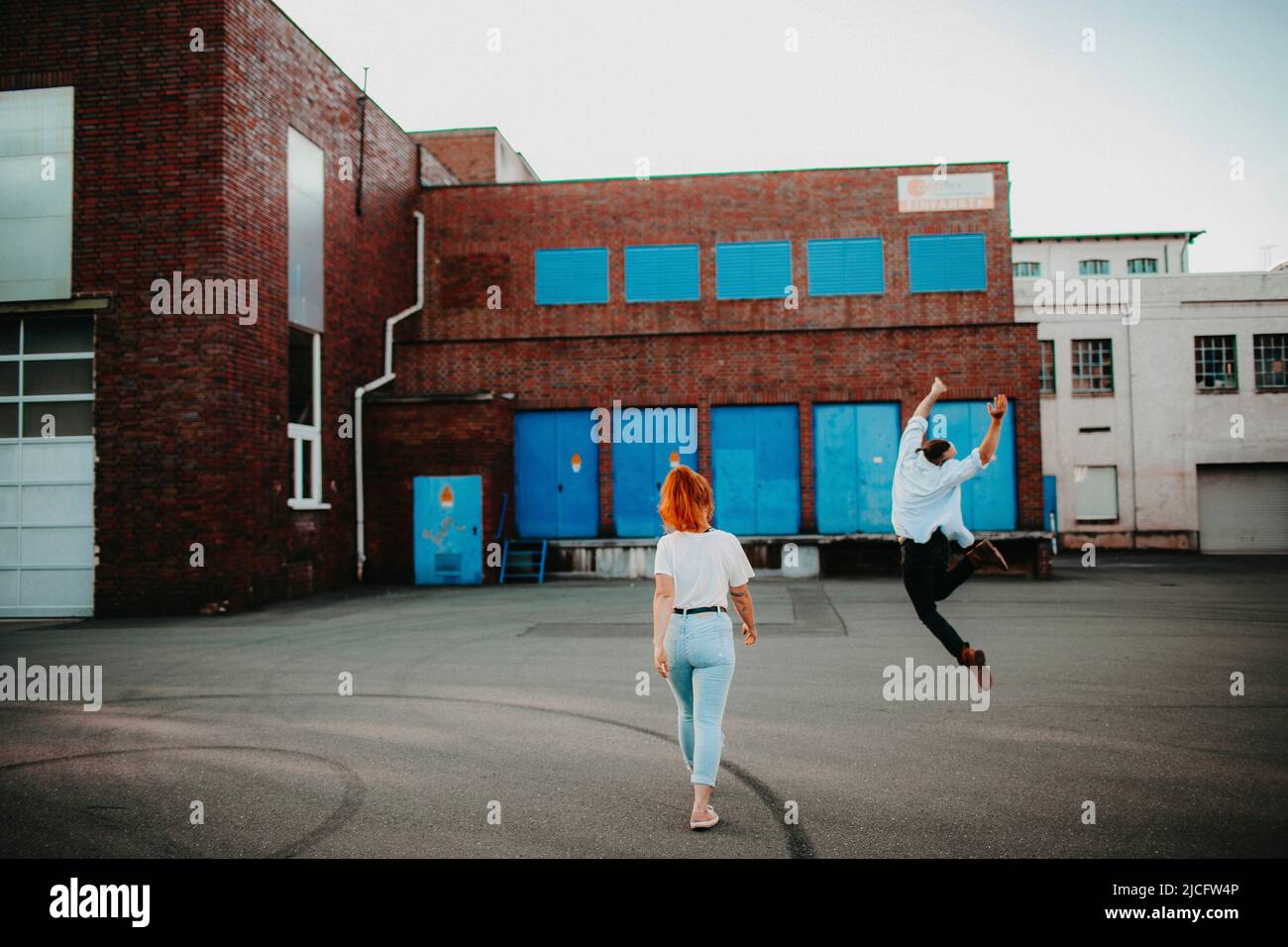 Happy young woman jumping air hi-res stock photography and images - Alamy