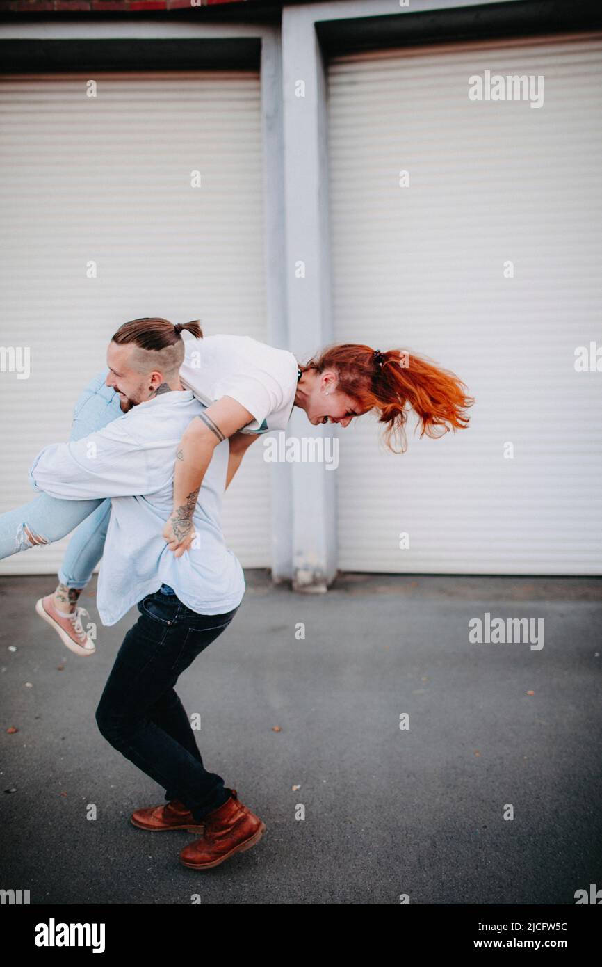 Young couple in love, fun, fooling around, outside Stock Photo