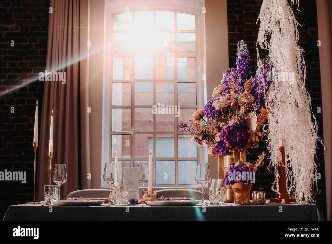 Festively set table with decoration Stock Photo