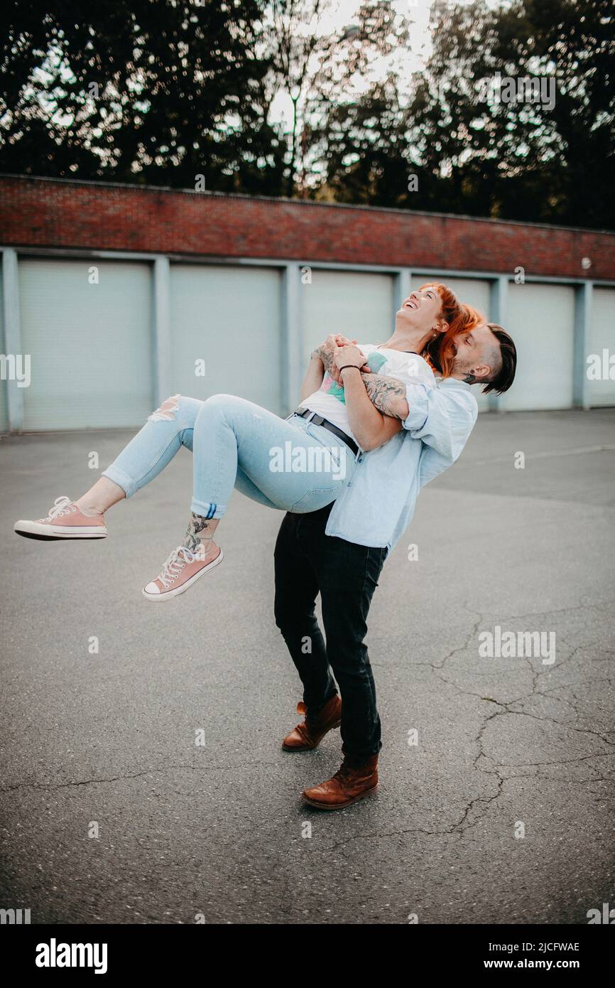 Young couple in love, fun, fooling around, outside Stock Photo