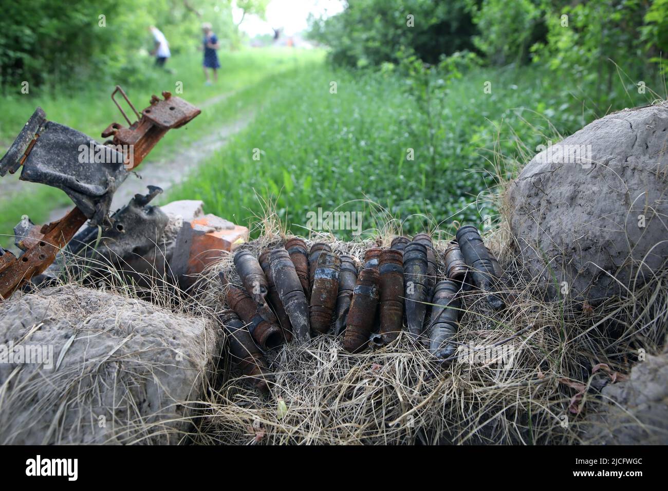 KYIV REGION, UKRAINE - JUNE 4, 2022 - The remains of Russian military vehicles and ammunition are pictured on the outskirts of Vovchkiv village where Stock Photo
