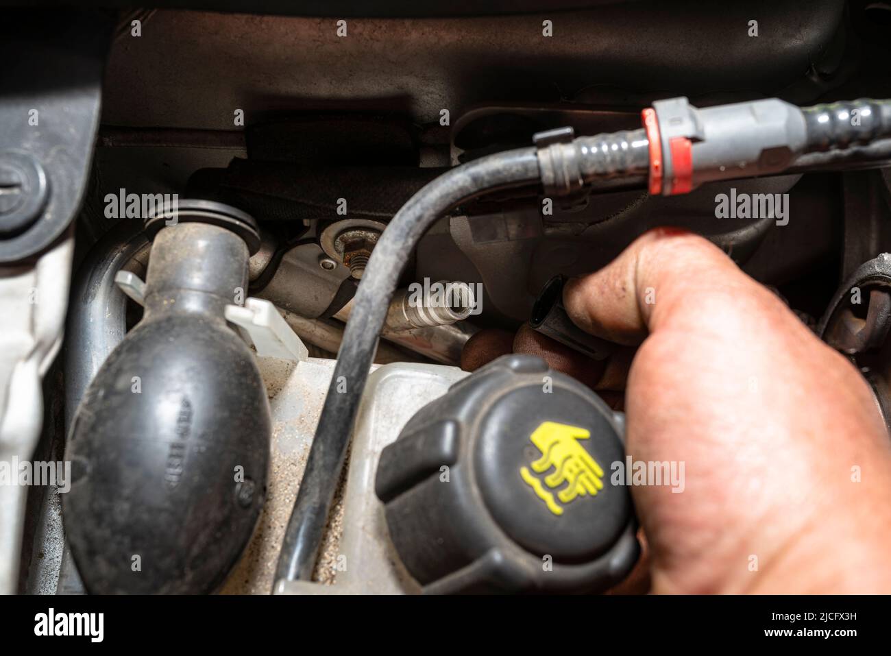 Open valves in passenger car air conditioning system for charging with R134a refrigerant Stock