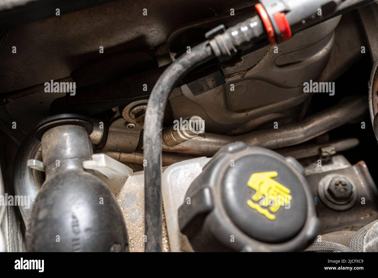 Open valves in passenger car air conditioning system for charging with