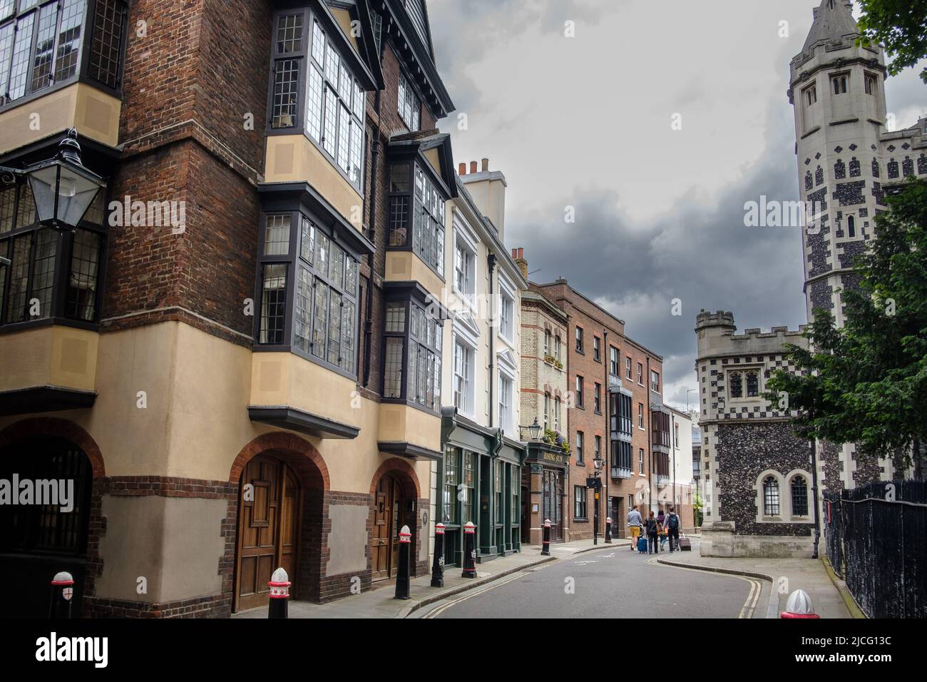 Cloth Fair, Smithfield, on the left no. 41/42 the oldest residential dwelling in London, on the right the church of St. Bartholomew-the-Great. Stock Photo