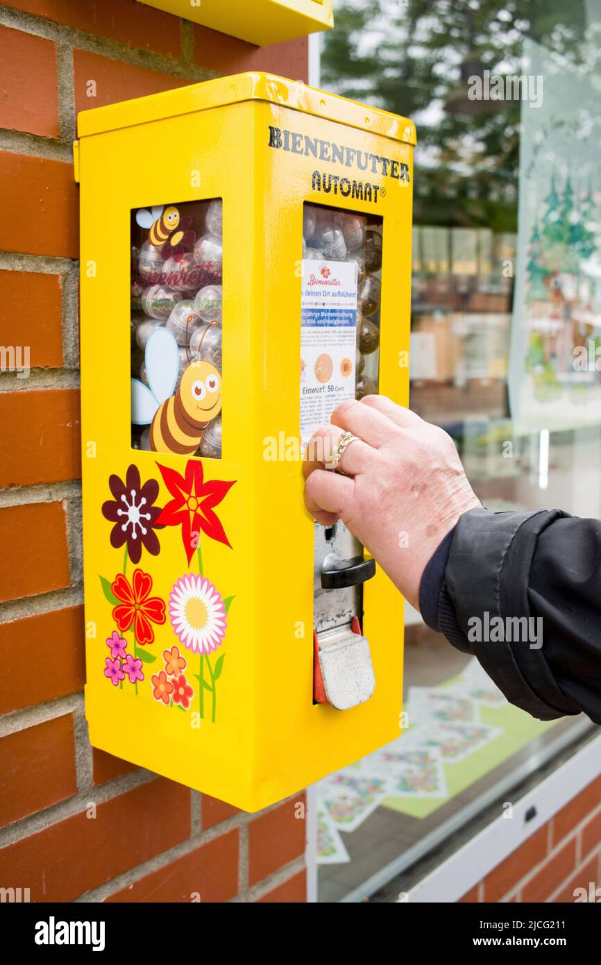 Seed capsules in the vending machine for wild and honey bees against species extinction Stock Photo
