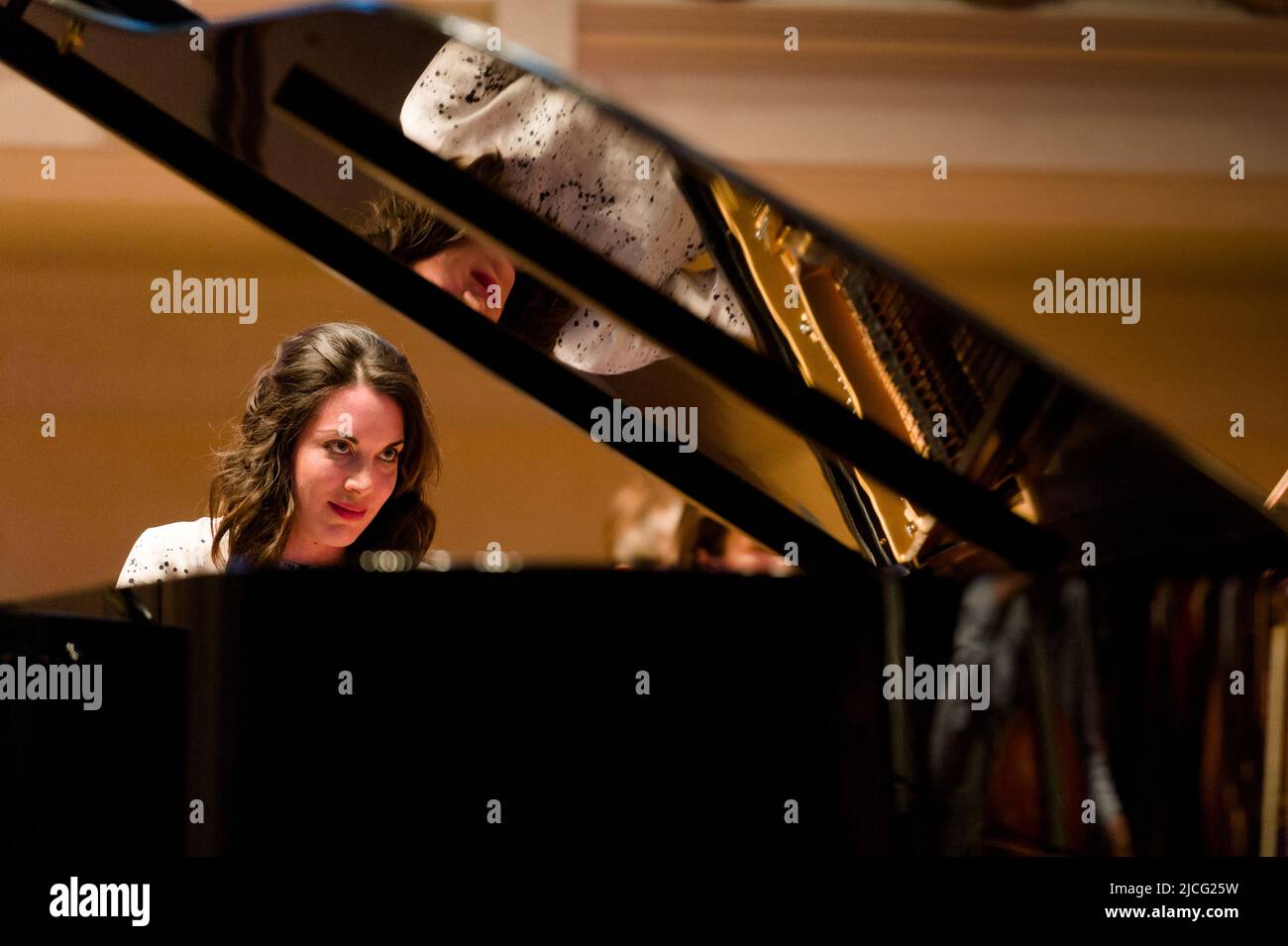 Italian pianist, Gloria Campaner rehearsing for that nights concert with the English Chamber Orchestra, conducted by the Japanese conductor Daisuke Mu Stock Photo