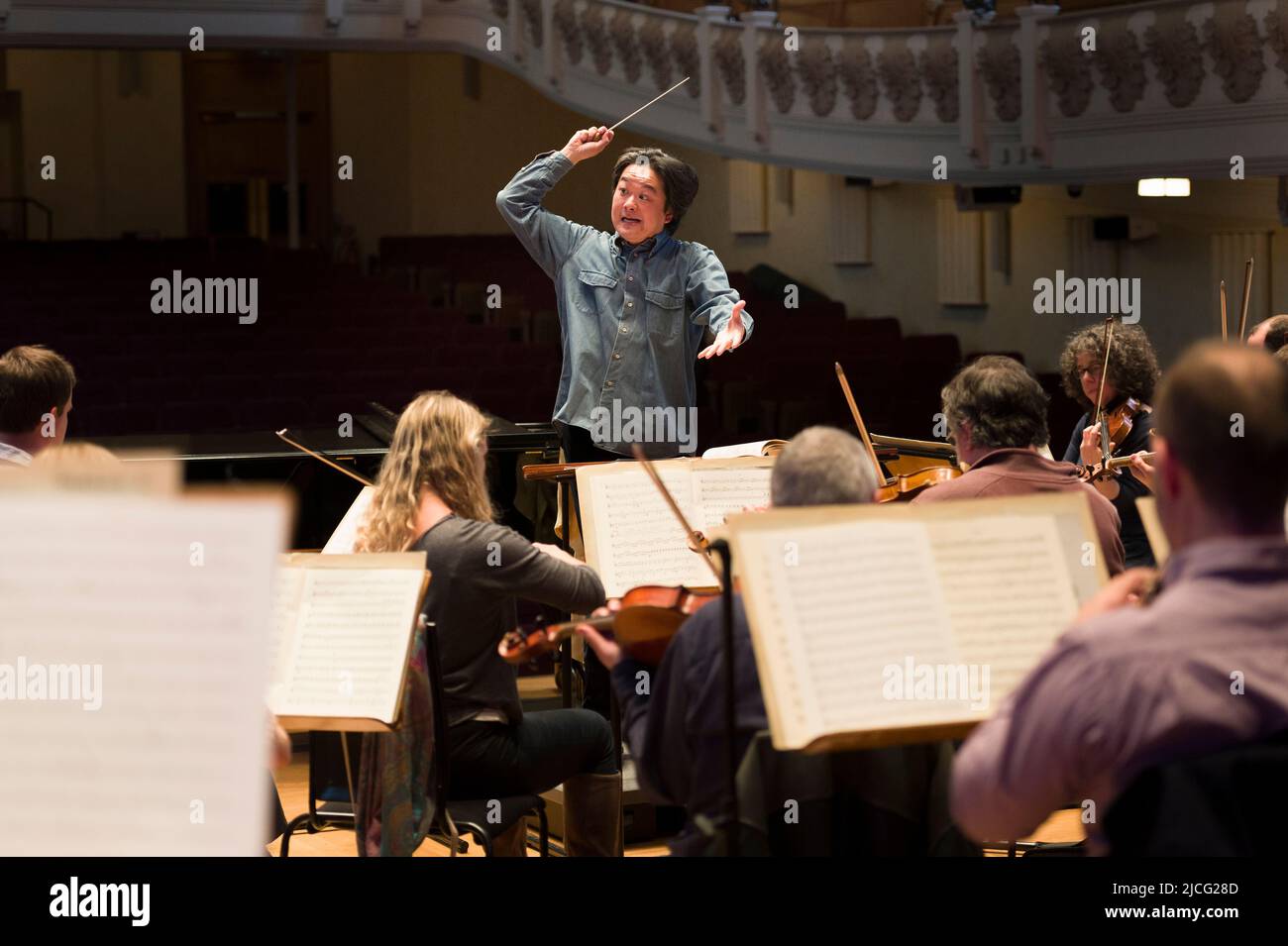 Japanese conductor Daisuke Muranaka conducting a rehearsal of the English Chamber Orchestra, before that nights concert.  Cadogan Hall, Sloane Terrace Stock Photo