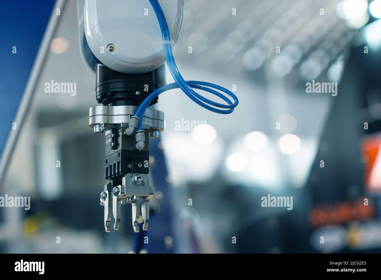 A robotic arm. Automatic robot in a smart factory. Assembly line Stock Photo