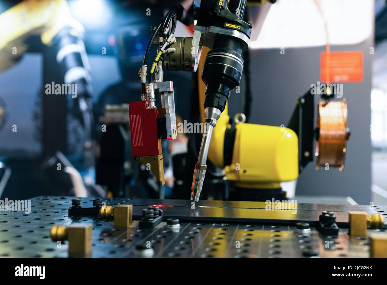 Gas cutter on the robot arm.Close-up of welding robot arm Stock Photo
