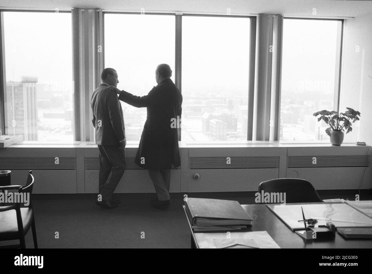 Axel Caesar SPRINGER, Germany, publisher, right, and Peter TAMM, long-standing management chairman of Axel Springer Verlag, are standing at the window of the Springer high-rise in Berlin and looking out over the city, January 15, 1966. ¬ Stock Photo