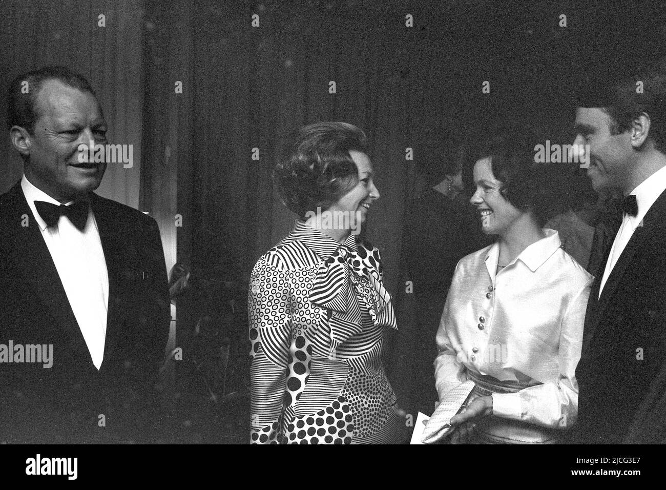 Willy BRANDT, SPD, Federal Chancellor, with his wife Rut, in conversation with Ninja FRAHM, (daughter of Willy Brandt from his first marriage with Carlota THORKILDSEN) and her fiancé, festive wardrobe, sideways, B/W photo, April 25th, 1970. Stock Photo