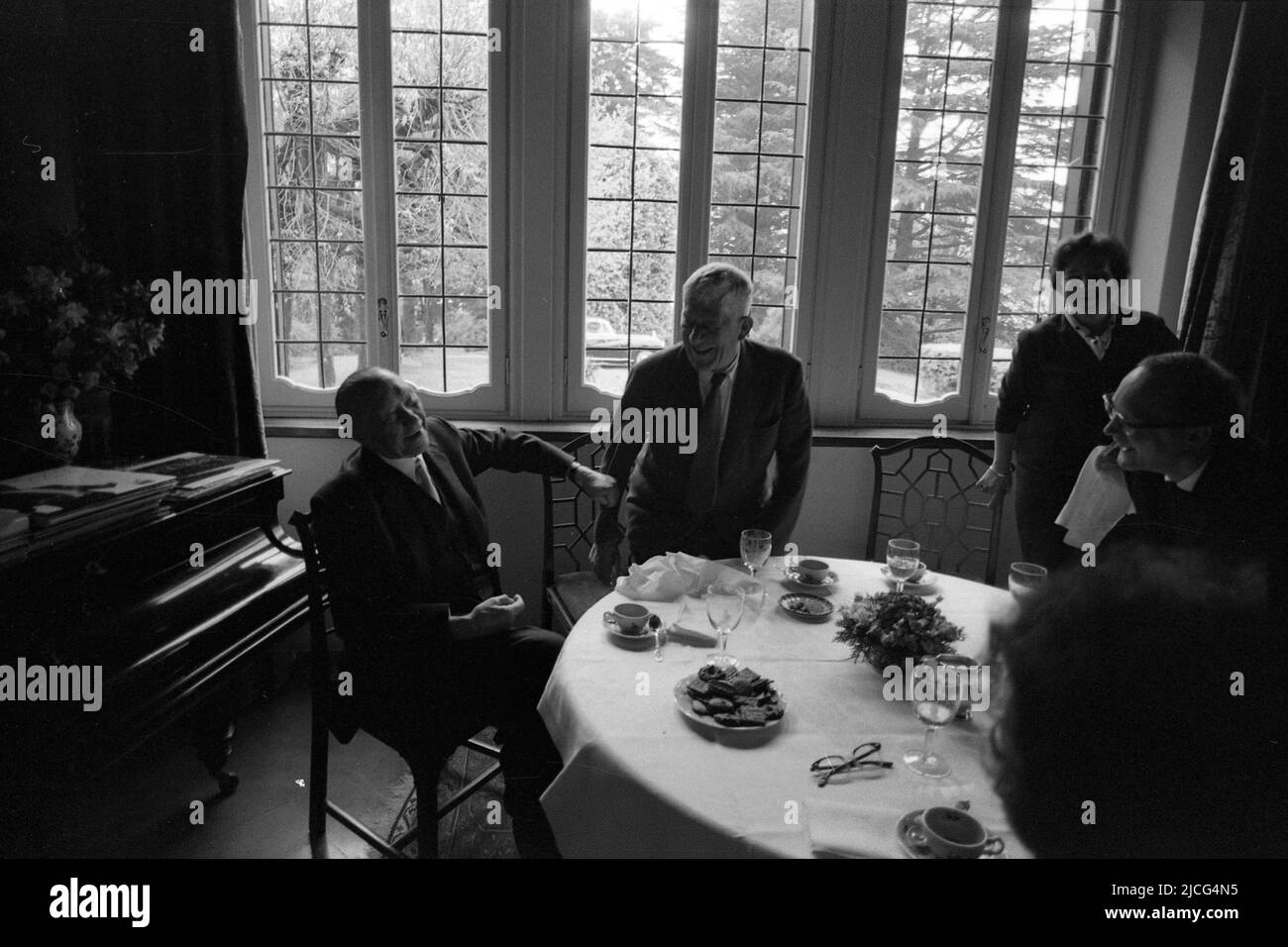 Oskar KOKOSCHKA (centre), Austria, painter, sits with his wife Olda and former Federal Chancellor Konrad ADENAUER, CDU, at a table, coffee table, they joke, friendly, April 15, 1966 Stock Photo