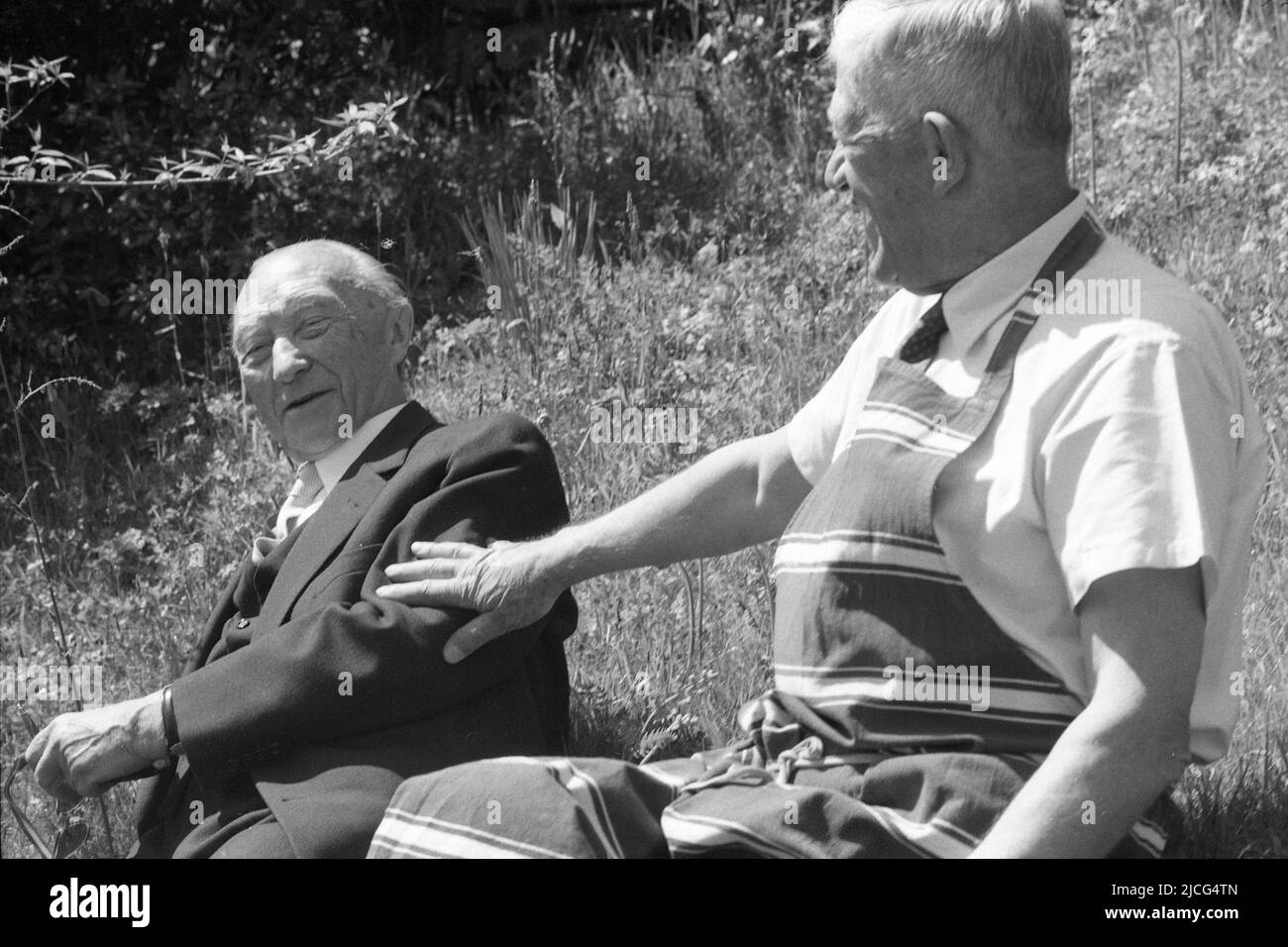Oskar KOKOSCHKA (right), Austria, painter, sits with former Federal Chancellor Konrad ADENAUER, CDU, in a meadow, friendly gesture, April 15, 1966 Stock Photo