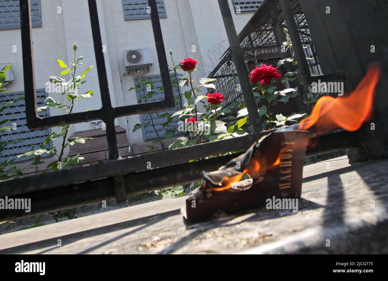 Kiev, Ukraine - June 12, 2022 - A Russian passport is engulfed in ...