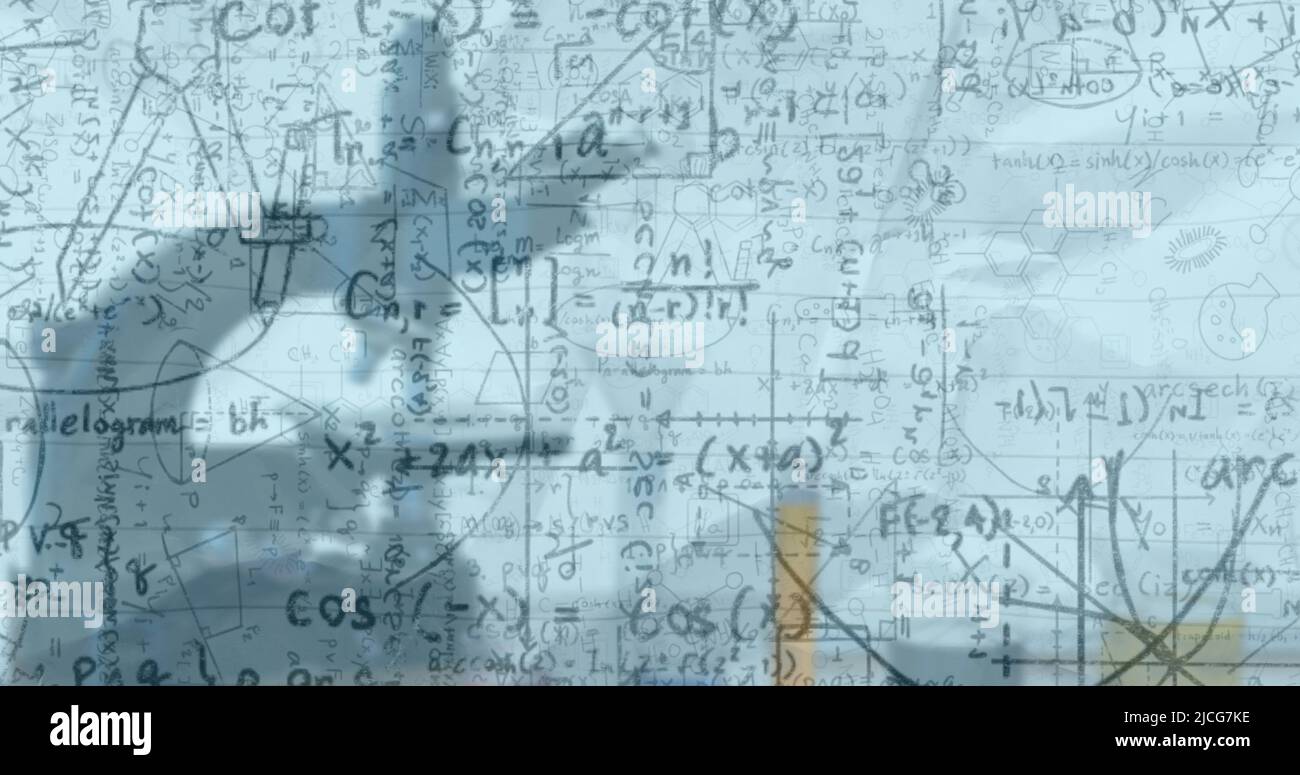 Image of mathematical equations over microscope in classroom Stock