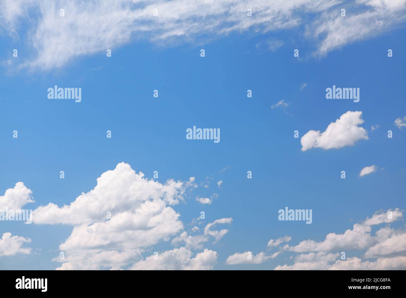 Fluffy clouds at blue sky . Heaven in the summer Stock Photo - Alamy