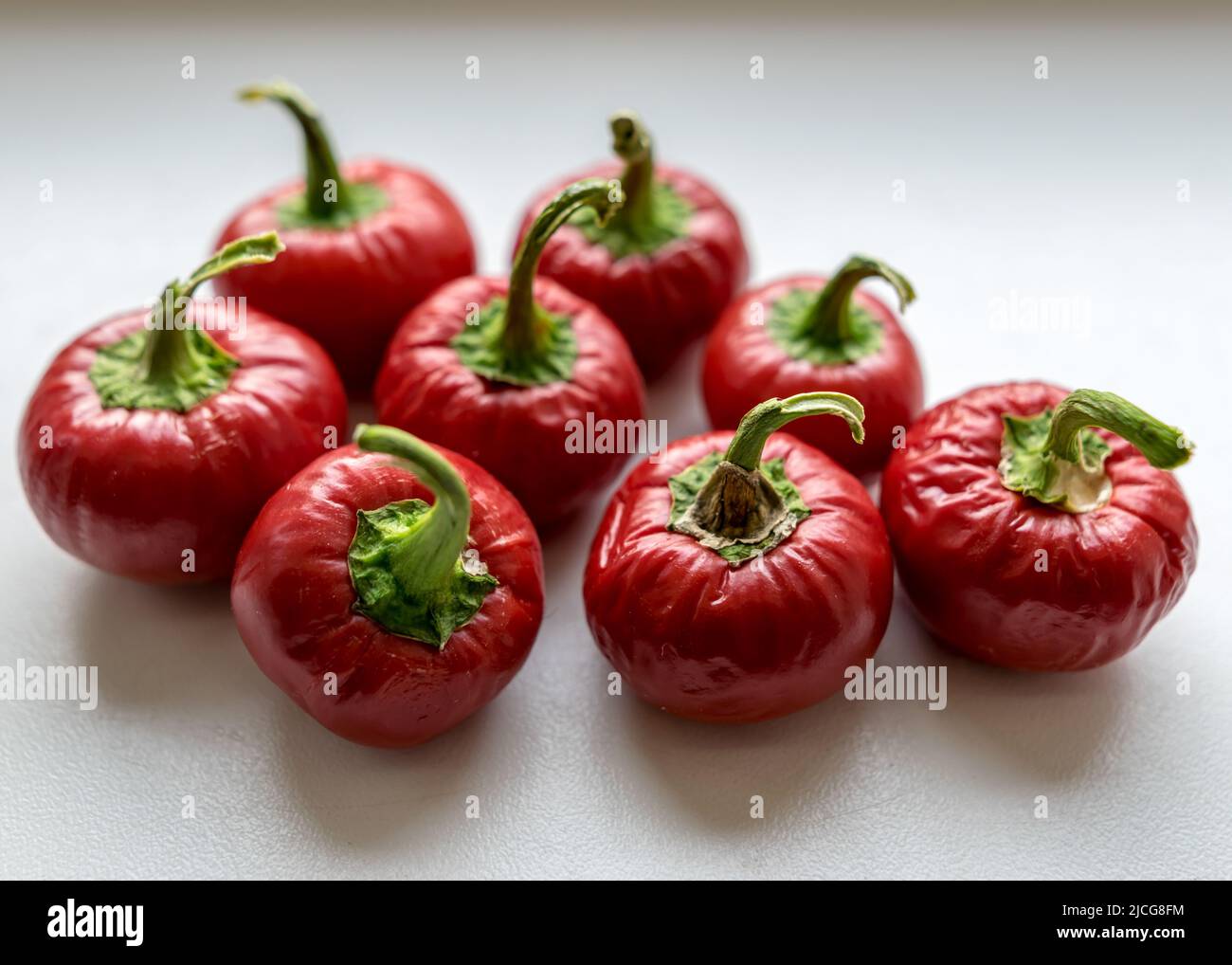 Red Mini Peper beautiful red mini peppers on a light background, suitable for ...
